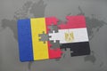 puzzle with the national flag of romania and egypt on a world map