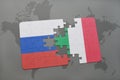 puzzle with the national flag of russia and italy on a world map background. Royalty Free Stock Photo