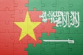 Puzzle with the national flag of saudi arabia and vietnam