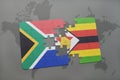 puzzle with the national flag of south africa and zimbabwe on a world map. Royalty Free Stock Photo