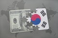 puzzle with the national flag of south korea and dollar banknote on a world map background. Royalty Free Stock Photo