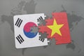 puzzle with the national flag of south korea and vietnam on a world map background. Royalty Free Stock Photo