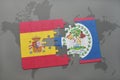 puzzle with the national flag of spain and belize on a world map background.