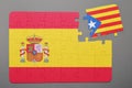 Puzzle with national flag of Spain and catalonia piece detached