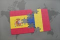 puzzle with the national flag of spain and romania on a world map background.