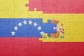 Puzzle with the national flag of spain and venezuela