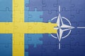 Puzzle with the national flag of sweden and nato