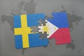 puzzle with the national flag of sweden and philippines on a world map background.
