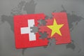 puzzle with the national flag of switzerland and vietnam on a world map background. Royalty Free Stock Photo