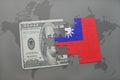 puzzle with the national flag of taiwan and dollar banknote on a world map background. Royalty Free Stock Photo