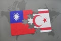 puzzle with the national flag of taiwan and northern cyprus on a world map background. Royalty Free Stock Photo