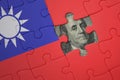 puzzle with the national flag of taiwan and usa dollar banknote. finance concept Royalty Free Stock Photo