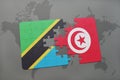 puzzle with the national flag of tanzania and tunisia on a world map