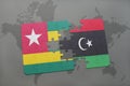 puzzle with the national flag of togo and libya on a world map