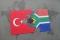 puzzle with the national flag of turkey and south africa on a world map Royalty Free Stock Photo