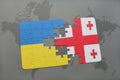 puzzle with the national flag of ukraine and georgia on a world map background. Royalty Free Stock Photo