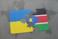 puzzle with the national flag of ukraine and south sudan on a world map Royalty Free Stock Photo