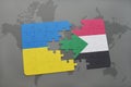 puzzle with the national flag of ukraine and sudan on a world map Royalty Free Stock Photo