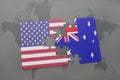 Puzzle with the national flag of united states of america and australia on a world map background