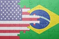 Puzzle with the national flag of united states of america and brazil Royalty Free Stock Photo