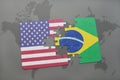 Puzzle with the national flag of united states of america and brazil on a world map background Royalty Free Stock Photo