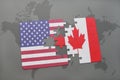 Puzzle with the national flag of united states of america and canada on a world map background Royalty Free Stock Photo
