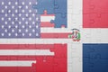 Puzzle with the national flag of united states of america and dominican republic Royalty Free Stock Photo