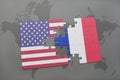 Puzzle with the national flag of united states of america and france on a world map background Royalty Free Stock Photo