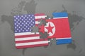 puzzle with the national flag of united states of america and north korea on a world map background Royalty Free Stock Photo