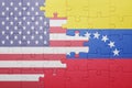 Puzzle with the national flag of united states of america and venezuela