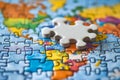 A puzzle piece sitting on top of a puzzle piece on a map Royalty Free Stock Photo