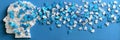 Puzzle Pieces Arranged to Form a Human Head Silhouette With Scattered Blue and White Elements, Representing Creativity Royalty Free Stock Photo