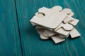 Puzzle pieces on blue wooden background Royalty Free Stock Photo