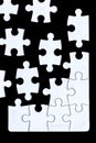 Puzzle pieces coming together Royalty Free Stock Photo