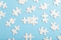 Puzzle pieces are connected. White puzzle pieces on a blue background. Business, partner, solution, alliance, union Royalty Free Stock Photo