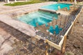 Puzzle Pieces Fitting Together Revealing Finished Pool Build Over Construction Royalty Free Stock Photo