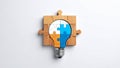 Puzzle pieces forming a lightbulb concept on a white background, teamwork idea Royalty Free Stock Photo