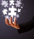 Puzzle pieces in the hand of a businessman Royalty Free Stock Photo