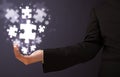 Puzzle pieces in the hand of a businessman Royalty Free Stock Photo