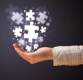 Puzzle pieces in the hand of a woman Royalty Free Stock Photo