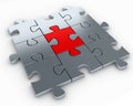 Puzzle pieces, with a red piece in the middle Royalty Free Stock Photo