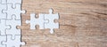 Puzzle pieces on wood table background. Business solutions, mission target, successful, goals, cooperation, partnership and Royalty Free Stock Photo