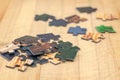 Puzzle pieces on a wooden background Royalty Free Stock Photo