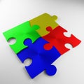 Puzzle, puzzle piece, red, blue, green, yellow, metal Royalty Free Stock Photo