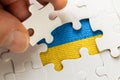 the puzzle reveals the flag of ukraine, the concept of the economic, military and social situation of the country Royalty Free Stock Photo