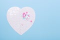 Puzzle in shape of heart white and pink pills on blue background Jigsaw Concept treatment of heart disease pills Royalty Free Stock Photo