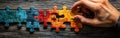 Puzzle Solving Closeup with Copy Space: Hands Concentrating on Aligning Colorful Pieces in Chaotic Arrangement, Ideal fo