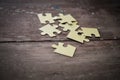 Puzzle on wooden background Royalty Free Stock Photo