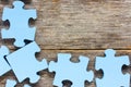 Puzzle on wooden boards Royalty Free Stock Photo