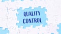 A puzzle with the word quality control written in blue Royalty Free Stock Photo